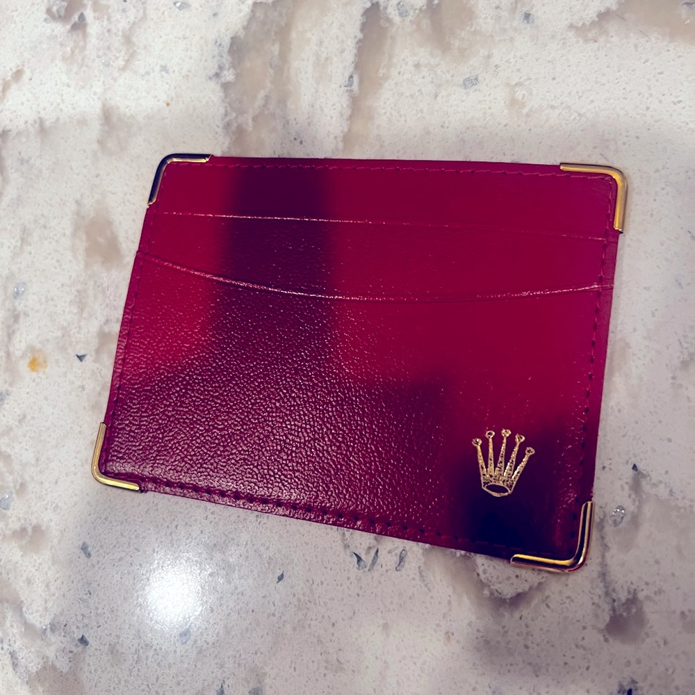 Rolex wallet and Rolex handkerchief.